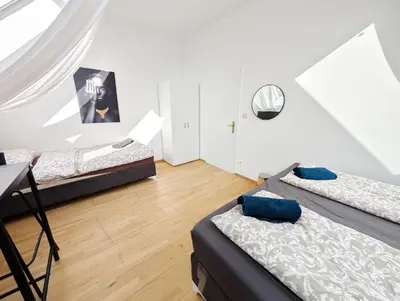 Ein Bett oder Betten in einem Zimmer der Unterkunft Lovely Rooms in Märzstraße Area MZ49