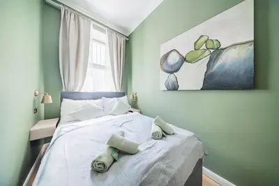 Ein Bett oder Betten in einem Zimmer der Unterkunft HOME1 - Jardin Boutique Hostel
