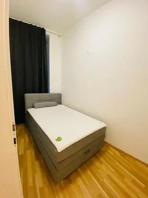 Ein Bett oder Betten in einem Zimmer der Unterkunft ApartSiebenbrunneng4