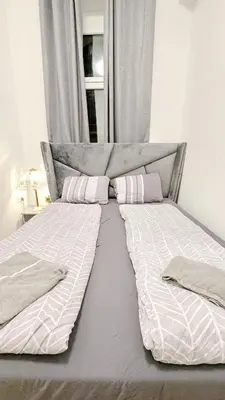 Ein Bett oder Betten in einem Zimmer der Unterkunft Comfortable rooms in Lugner City area HE