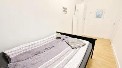 Ein Bett oder Betten in einem Zimmer der Unterkunft Comfortable rooms in Lugner City area HE