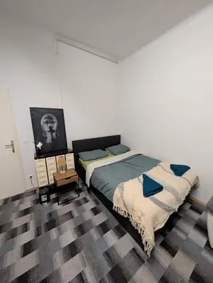 Ein Bett oder Betten in einem Zimmer der Unterkunft Cozy Apartment in Simmering