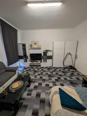 Ein Bett oder Betten in einem Zimmer der Unterkunft Cozy Apartment in Simmering