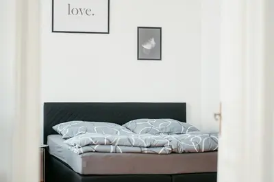 Ein Bett oder Betten in einem Zimmer der Unterkunft Stylisches City -Apartment