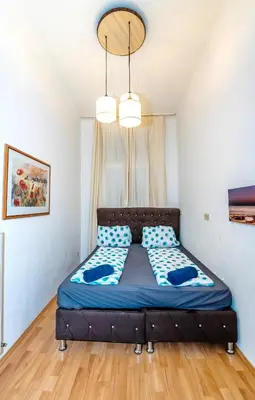 Ein Bett oder Betten in einem Zimmer der Unterkunft Family Apartment near Schönbrunn Palace HL18