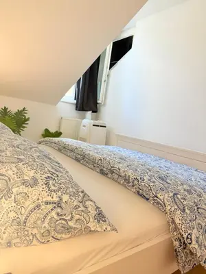 Ein Bett oder Betten in einem Zimmer der Unterkunft Cozy Family Rooftop