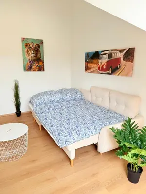 Ein Bett oder Betten in einem Zimmer der Unterkunft Cozy Family Rooftop