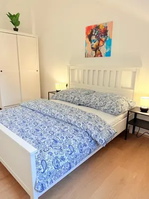 Ein Bett oder Betten in einem Zimmer der Unterkunft Cozy Family Rooftop