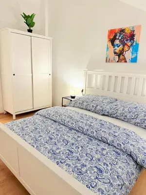 Ein Bett oder Betten in einem Zimmer der Unterkunft Cozy Family Rooftop