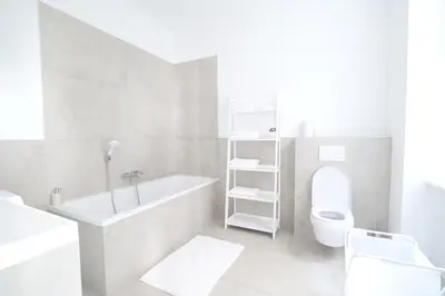 Ein Badezimmer in der Unterkunft Toplage beim Rathaus Grace Family City Apartment