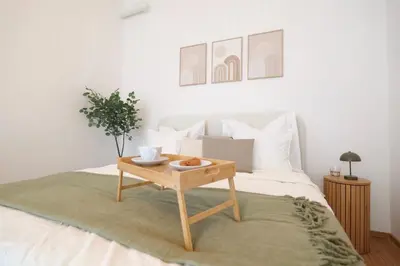 Ein Bett oder Betten in einem Zimmer der Unterkunft Toplage beim Rathaus Grace Royal Designsuite