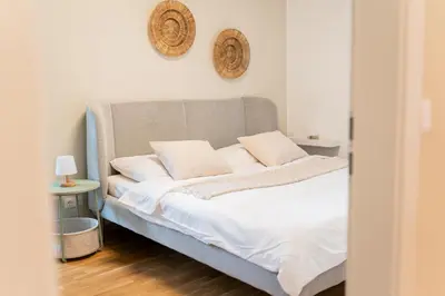 Ein Bett oder Betten in einem Zimmer der Unterkunft Zentrale Business- und Familienwohnung Nähe Wien