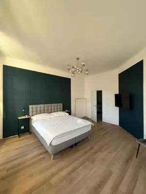 Ein Bett oder Betten in einem Zimmer der Unterkunft Apartment Schönbrunn Kingsiz Bed