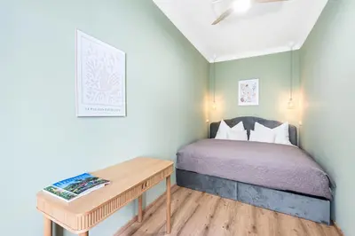 Ein Bett oder Betten in einem Zimmer der Unterkunft Mamalipa Apartments