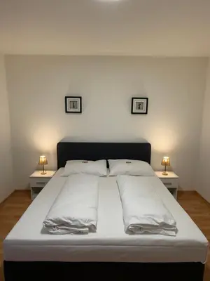 Ein Bett oder Betten in einem Zimmer der Unterkunft Airport Apartment Rauchenwarth