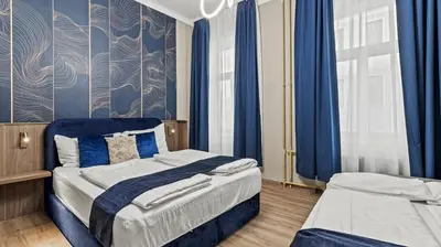 Ein Bett oder Betten in einem Zimmer der Unterkunft Odeon Apartments and Rooms I Self Check In