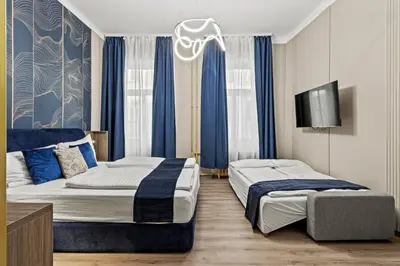 Ein Bett oder Betten in einem Zimmer der Unterkunft Odeon Apartments and Rooms I Self Check In