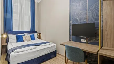 Ein Bett oder Betten in einem Zimmer der Unterkunft Odeon Apartments and Rooms I Self Check In