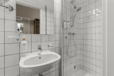 Ein Badezimmer in der Unterkunft Odeon Apartments and Rooms I Self Check In