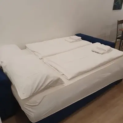 Ein Bett oder Betten in einem Zimmer der Unterkunft Cozy Vienna City Apartment near Central Station