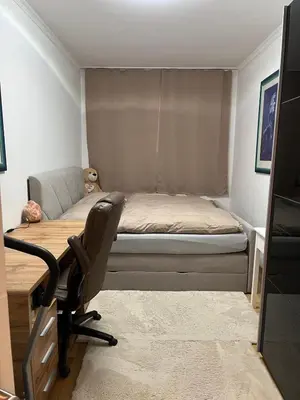 Ein Bett oder Betten in einem Zimmer der Unterkunft Moderne Ferienwohnung in Mödling bei Wien