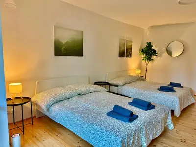 Ein Bett oder Betten in einem Zimmer der Unterkunft Luxury 130 m2 Apartment with Garden