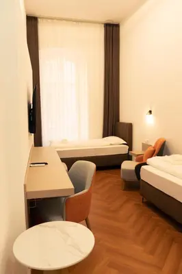 Ein Bett oder Betten in einem Zimmer der Unterkunft Elias Residence Vienna