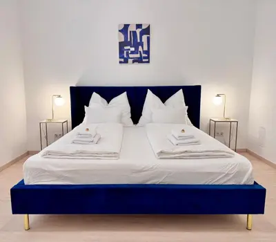 Ein Bett oder Betten in einem Zimmer der Unterkunft La Rosa Vienna - Luxury Apartment near Westbahnhof