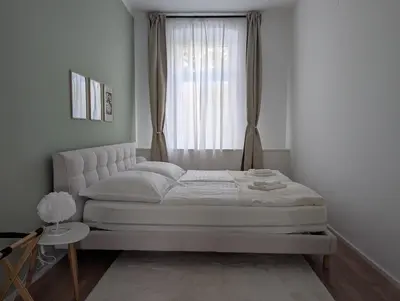 Ein Bett oder Betten in einem Zimmer der Unterkunft Habicher Vienna Apartments