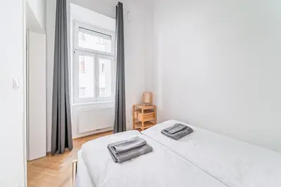 Ein Bett oder Betten in einem Zimmer der Unterkunft Trendy Schönbrunn Apartment