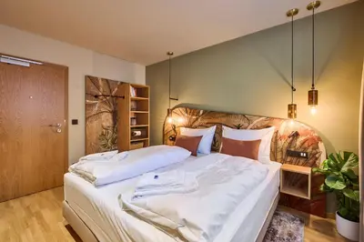 Ein Bett oder Betten in einem Zimmer der Unterkunft Hotel Karol