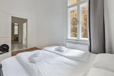 Ein Bett oder Betten in einem Zimmer der Unterkunft Grand Viennese Residence 2