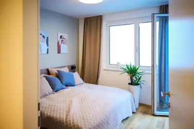 Ein Bett oder Betten in einem Zimmer der Unterkunft Bright apartments with spacious terraces offering comfort not far to Vienna's heart