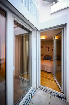Ein Bett oder Betten in einem Zimmer der Unterkunft Bright apartments with spacious terraces offering comfort not far to Vienna's heart