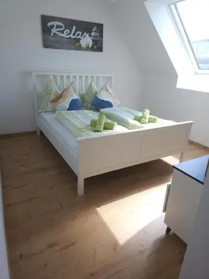 Ein Bett oder Betten in einem Zimmer der Unterkunft Coming Home - Penthouse Apartment