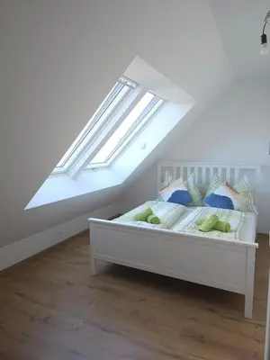 Ein Bett oder Betten in einem Zimmer der Unterkunft Coming Home - Penthouse Apartment