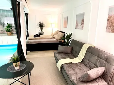Ein Sitzbereich in der Unterkunft UNO POOL Apartment
