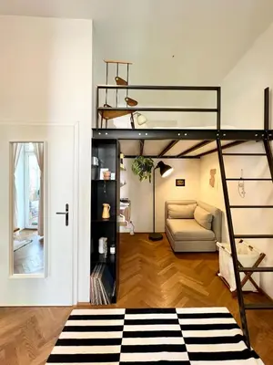 Ein Bett oder Betten in einem Zimmer der Unterkunft Stylish Central Apartment with Balcony
