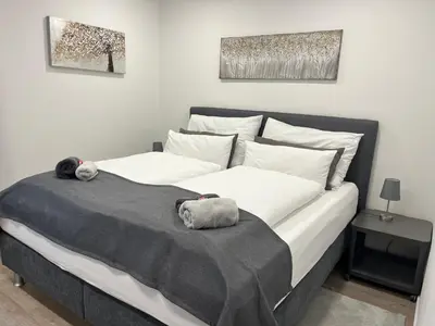 Ein Bett oder Betten in einem Zimmer der Unterkunft Rosis Appartement