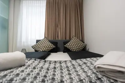Ein Bett oder Betten in einem Zimmer der Unterkunft Vienna Deluxe Residences - Schönbrunn