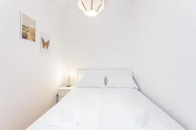 Ein Bett oder Betten in einem Zimmer der Unterkunft Central Cosy Stylish Apartment