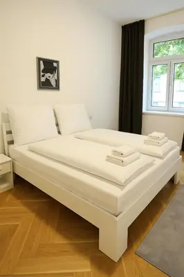 Ein Bett oder Betten in einem Zimmer der Unterkunft Céleste Suites