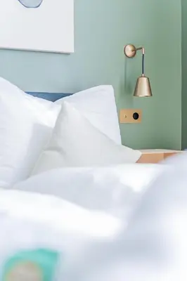 Ein Bett oder Betten in einem Zimmer der Unterkunft HOME1 - District 5 Boutique Hostel