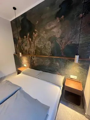 Ein Bett oder Betten in einem Zimmer der Unterkunft Residence K - Comfy Studio in Historic Townhouse