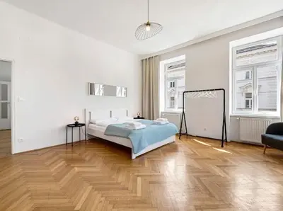 Ein Bett oder Betten in einem Zimmer der Unterkunft A&S Tivoli Apartment Vienna