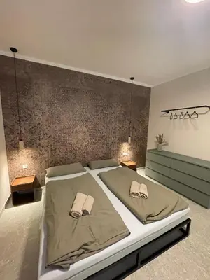Ein Bett oder Betten in einem Zimmer der Unterkunft Residence K - Authentic Charm & Modern Ease
