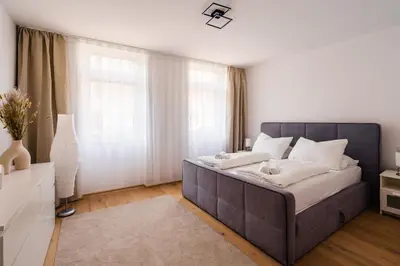 Ein Bett oder Betten in einem Zimmer der Unterkunft Melody Apartments Vienna