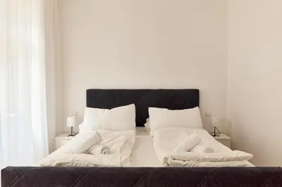 Ein Bett oder Betten in einem Zimmer der Unterkunft Melody Apartments Vienna