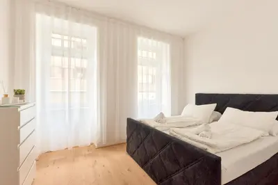 Ein Bett oder Betten in einem Zimmer der Unterkunft Melody Apartments Vienna