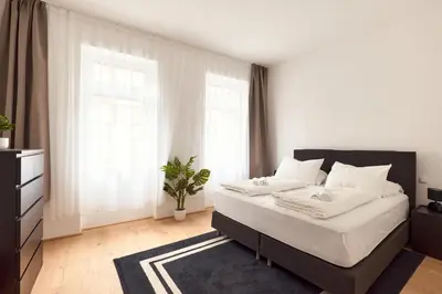 Ein Bett oder Betten in einem Zimmer der Unterkunft Melody Apartments Vienna